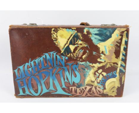 A vintage leather case with hand painted decoration Lightnin' Hopkins Texas Blues, approximately 23 cm x 35 cm x 10 cm.