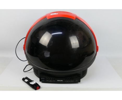 A vintage Phillips Discoverer television, designed in the form of a Space Helmet, with remote, 44 cm (h). [2]