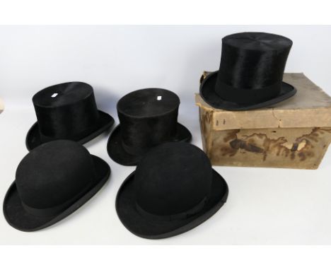 Five vintage hats comprising three top hats and two bowlers, G A Dunn and similar.Condition Report: Approximate internal meas