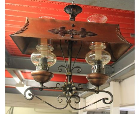 A wrought iron and copper oil lamp style electric ceiling light
