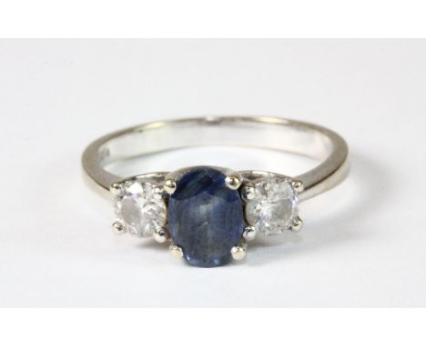 An 18ct white gold ring set with a sapphire and 2 diamonds (M)