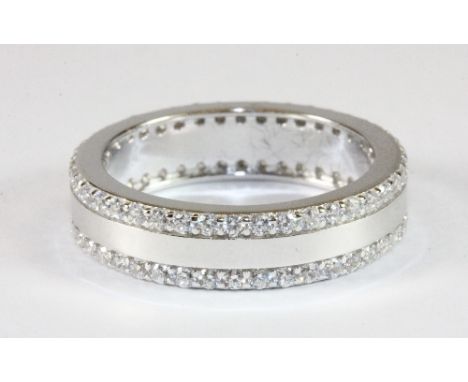 A 925 silver and stone set double eternity/wedding ring (R.5)