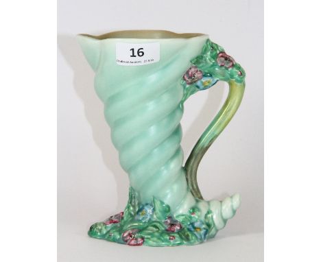 A Clarice Cliff Cornucopia jug, H 18cm
