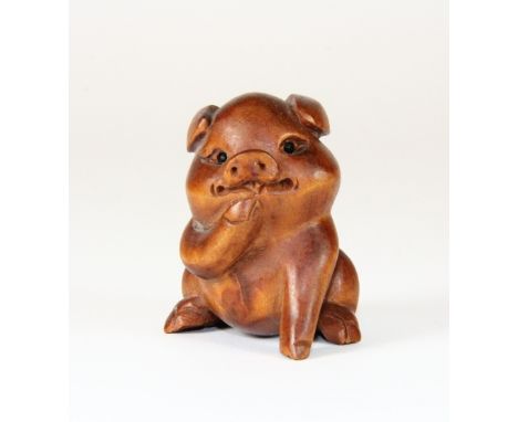 An amusing signed carved fruitwood netsuke of a piglet with black onyx eyes