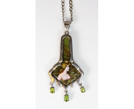 A .925 silver mounted Art Nouveau style enamel pendant decorated with three suspended peridot on a .925 silver chain.