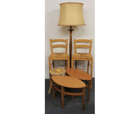 A pair of rush seated bar stools, a pair of tables, a revolving stool and a standard lamp