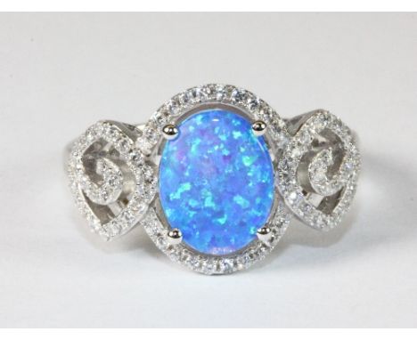 A pretty 925 silver and blue faux opal ring (Q)