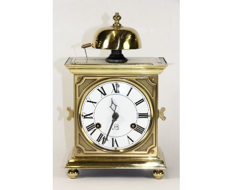 A striking Dutch brass mantle clock