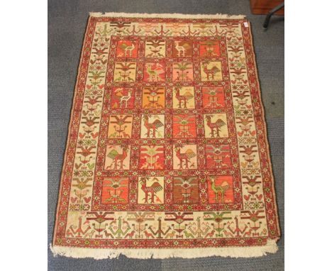 A hand woven eastern rug, 106cm x 147cm