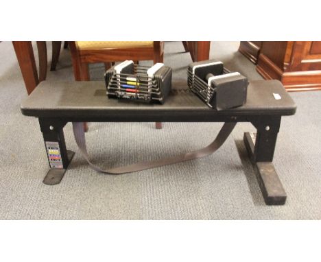 An exercise bench and set of Sport Block hand weights
