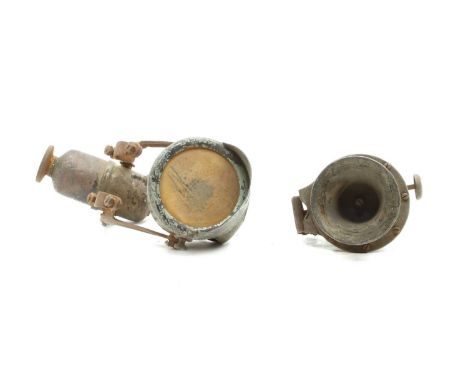A Lucas acetylene motorcycle lighting set, comprising No. 58 remote generator with twin brackets attached to peaked headlamp 