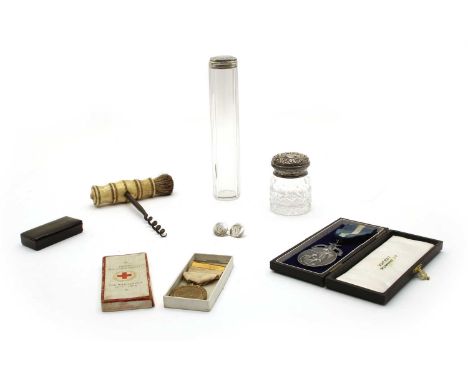 A bone and steel single brush corkscrew, 19th century, a British Red Cross Society medal, a silver masonic medal 'Aegros Sana