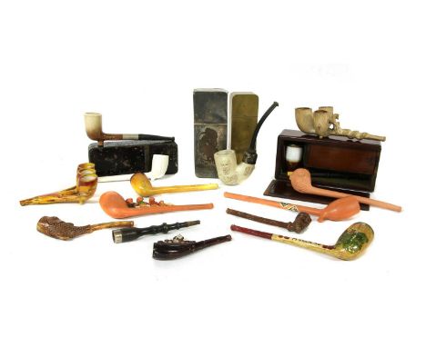 A collection of mixed clay pipes, four tin, brass and wood pipe cases, the wood box stamped 'S. Walker', and one engraved wit