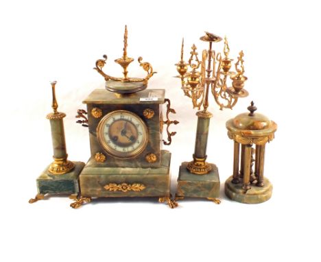 A green Onyx and gilt metal mantel clock with various side pieces