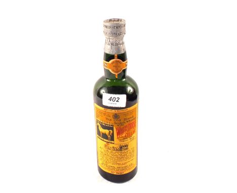 A bottle of White Horse Collar, The Old blend Scotch Whisky, 1956, No.752949
