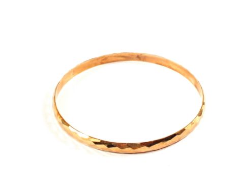 A bangle stamped 14K