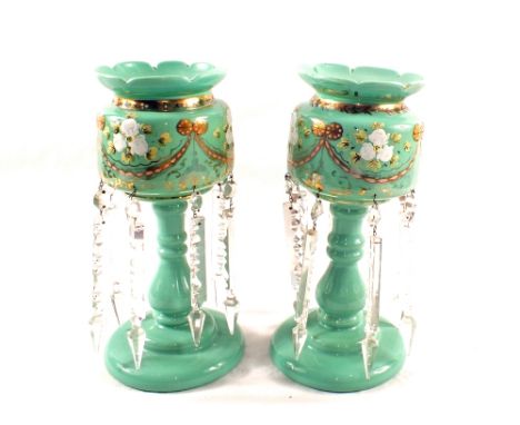 A pair of Victorian green opal glass table lustres with floral decoration