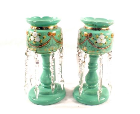 A pair of Victorian green opal glass table lustres with floral decoration