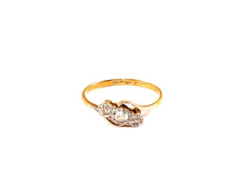 An 18ct Gold three stone ring, size K 1/2