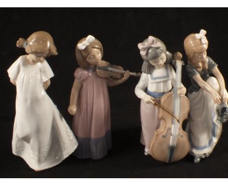 Three Nao figurines of girl musicians plus one other