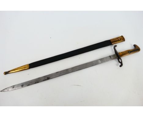 An 1871 pattern dress bayonet with 48 cm (l) double etched blade (faintly visible), nickel plated turned up quillon, bird bea