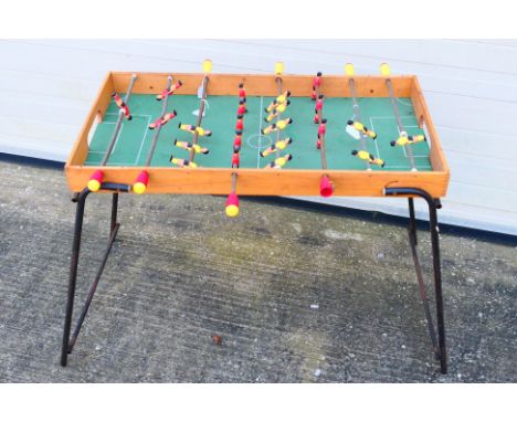 A vintage table football game. [W]