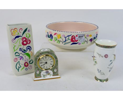 Lot to include a Wedgwood vase and ceramic cased clock in the Humming Birds pattern, a Poole Pottery vase and bowl, largest p