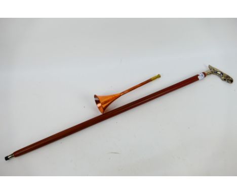 A walking stick with chrome jaguar form handle and a copper hunting horn. [2]. [W]