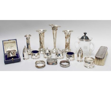 A Collection of Assorted Silver, to include: posy vases, mustard pots, a candle stick, napkin rings, etc. (Qty)