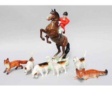 Beswick Hunting Group, comprising: Huntsman on Rearing Horse, model No. 868, four fox hounds, a fox, and another foreign-made