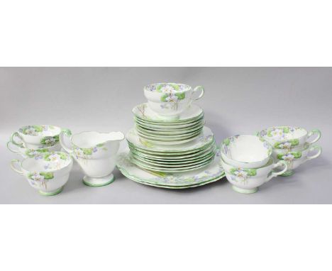 A Replica of the Paragon Wild Violets Tea Service, produced for HM Queen Mary comprising two cake plates, eight tea cups and 