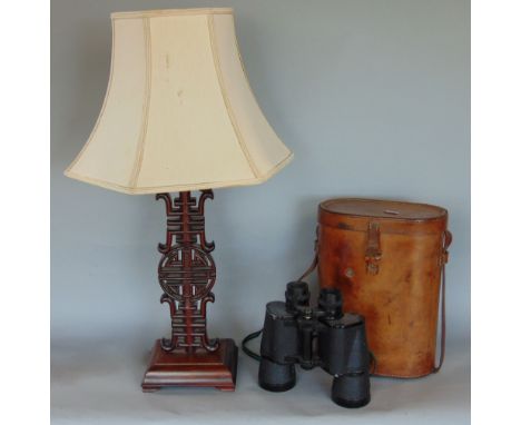 A carved Chinese hardwood table lamp, with pierced medallion decoration and shade; together with a pair of vintage binoculars