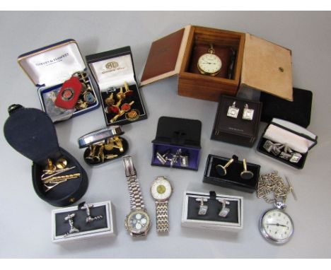 A box containing a collection of various vintage watches, cuff links, tie clips, etc