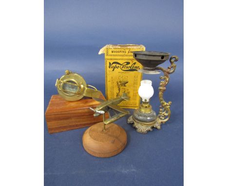 Cast brass model of an early aeroplane, together with a further cased compass and boxed vaporizer (3)