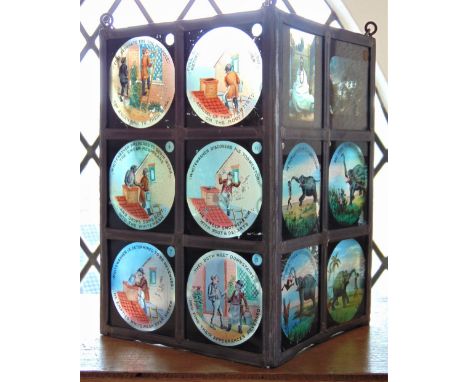 Interesting novelty four sided hanging hall lantern decorated with colourful magic lantern slides of various subjects, 27cm h