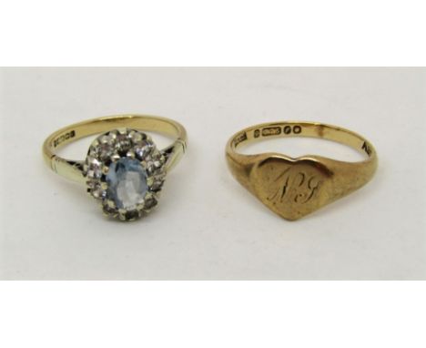 Two 9ct rings comprising a dress ring set with a pale aquamarine within goshenite surround, together with a heart shaped sign