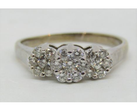 Diamond triple floral cluster ring in 14k white gold, central cluster 6mm approx, size U, 4.2g