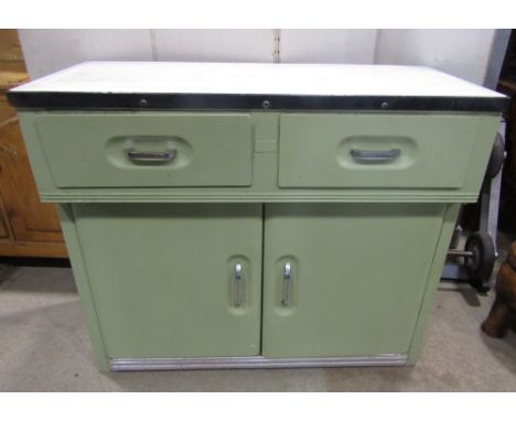 A vintage House-Proud aluminium kitchen cabinet enclosed by two panelled doors and two frieze drawers, set beneath an enamell