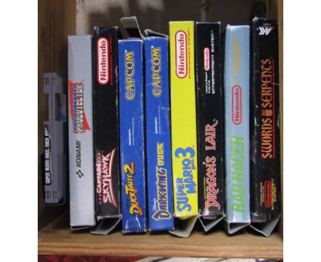 Nine vintage Nintendo games, Probotector, Super Mario 3, Dragons Lair, Rad Racer, Captain Skyhawk, Duck Tales 2, Darkwing Duc