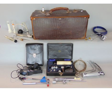 Vintage leather Gladstone doctors bag, fitted with various medical instruments to include stethoscopes, etc