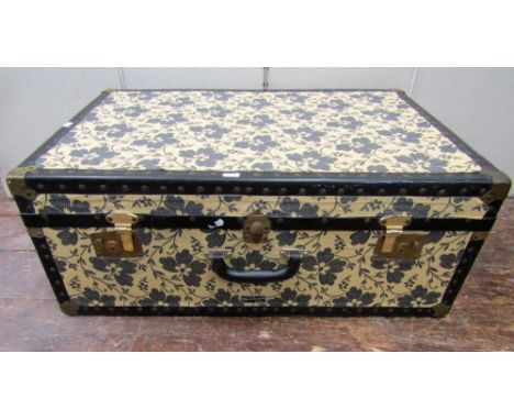 A vintage travelling case by Mossman with later applied fabric panel