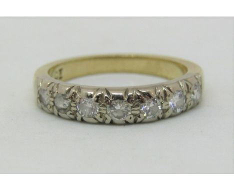 18ct half eternity ring set with seven diamonds of 0.10cts each approx, size K, 3.5g