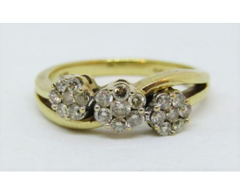 9ct crossover style ring set with a diamond triple floral cluster, size M, 3.1g