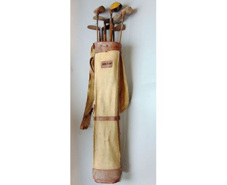 Collection of vintage golf clubs within a vintage golf bag