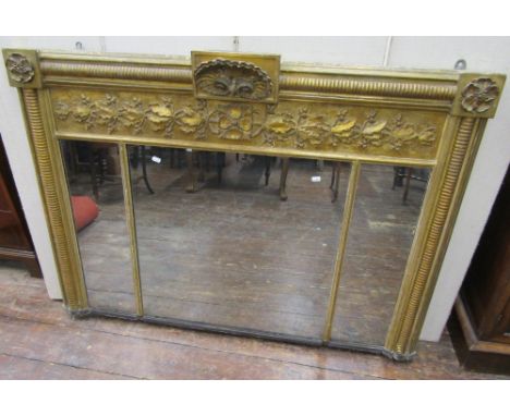 A Regency gilded overmantel mirror, the three mirror plates enclosed within decorative and gilded frames with repeating oak l