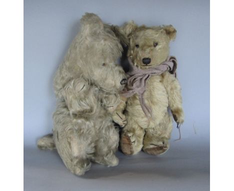 A vintage teddy bear with brown fur, stitched nose, mouth and claws, velveteen paws and articulated limbs, together with a py