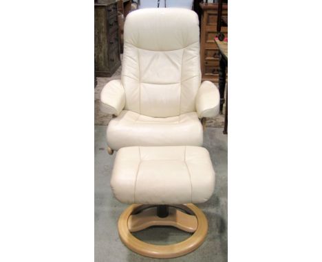 A contemporary soft cream leather upholstered swivel and adjustable lounge chair and matching footstool, both raised on circu