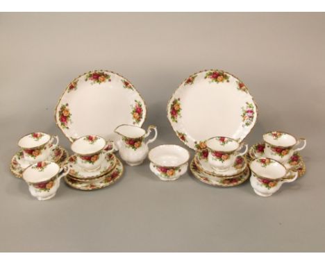 A six place Royal Albert Old Country Roses pattern tea service including a pair of cake plates, milk jug, sugar bowl, six cup