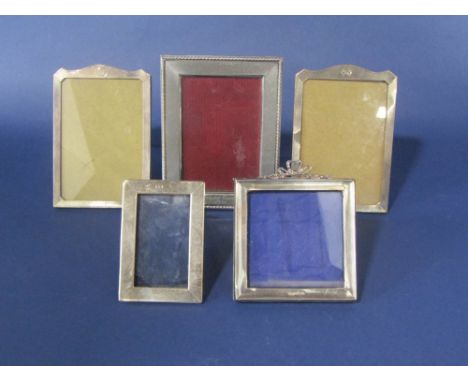 A collection of five various silver photo/picture easel frames, to include an engine turned pair (5)