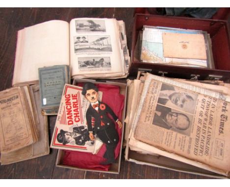 A miscellaneous collection of items to include a small suitcase containing a scrap album documenting various aviation feats, 